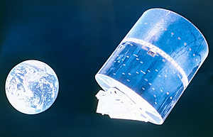 A picture of the earth from space and a cylindrical satellite next to it.